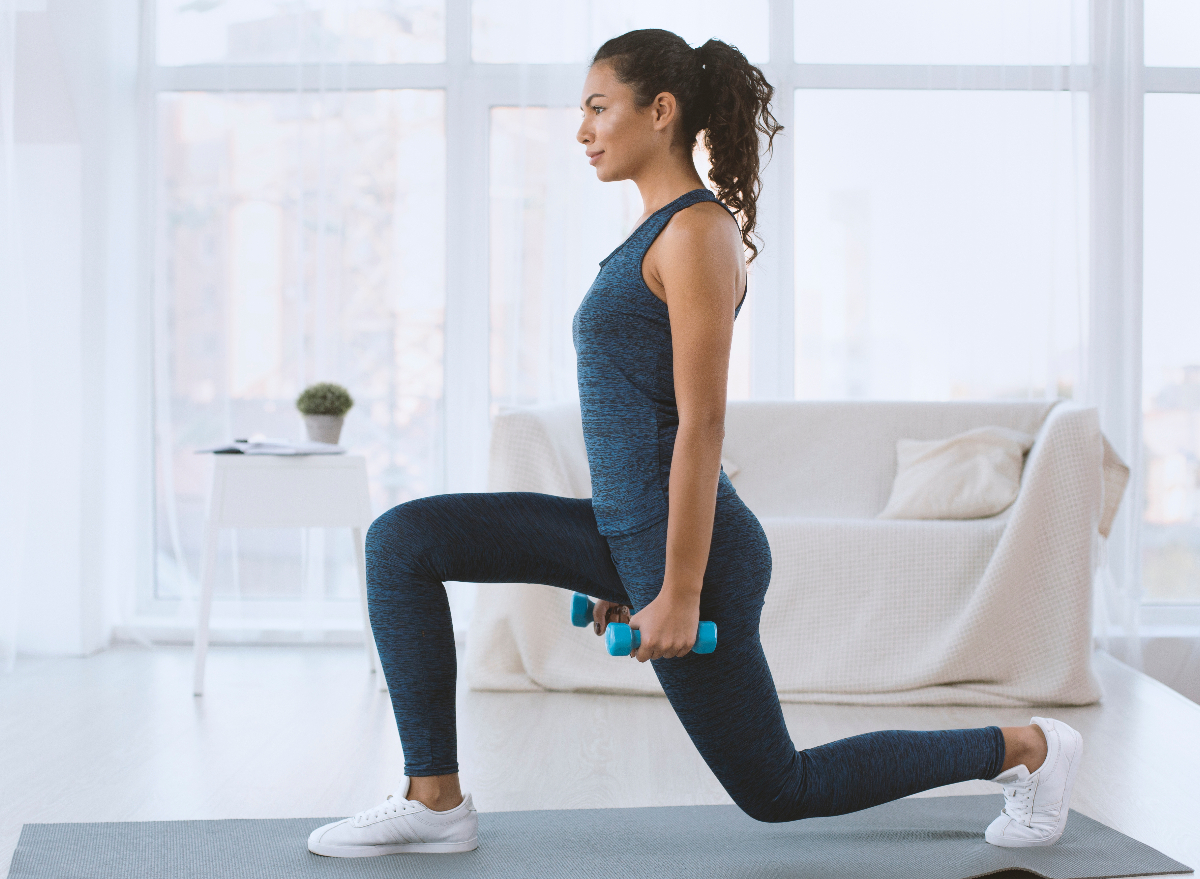 walking lunges with dumbbells to sculpt glutes