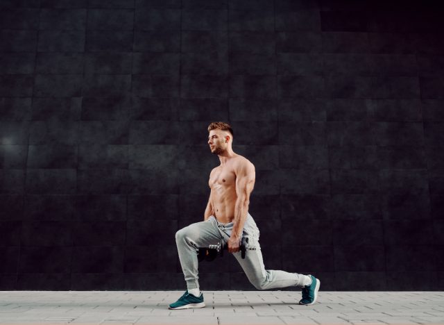 man doing lunges with dumbbells