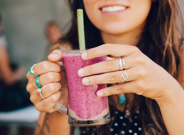 woman drinking smoothie