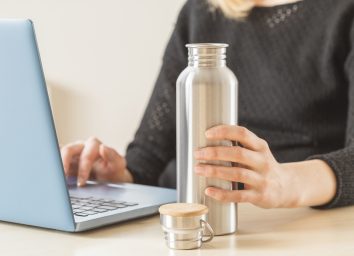 woman holding water bottle