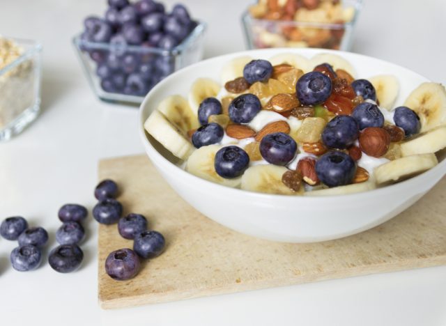 yogurt with blueberries, bananas, nuts, and honey