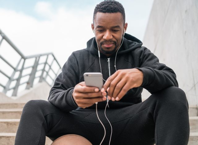 man on cell, taking a break from training