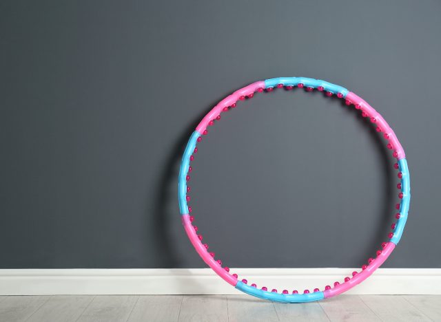 Weighted hula hoop against the wall