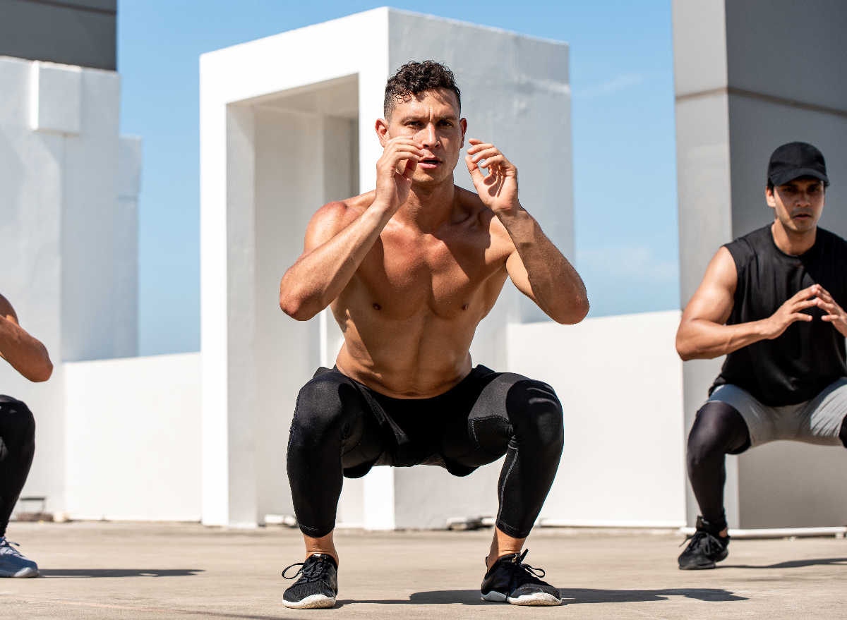 man doing squat jump