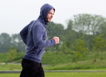man in 40s getting cardio in outdoors