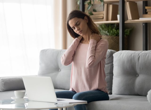 woman achey after being sedentary