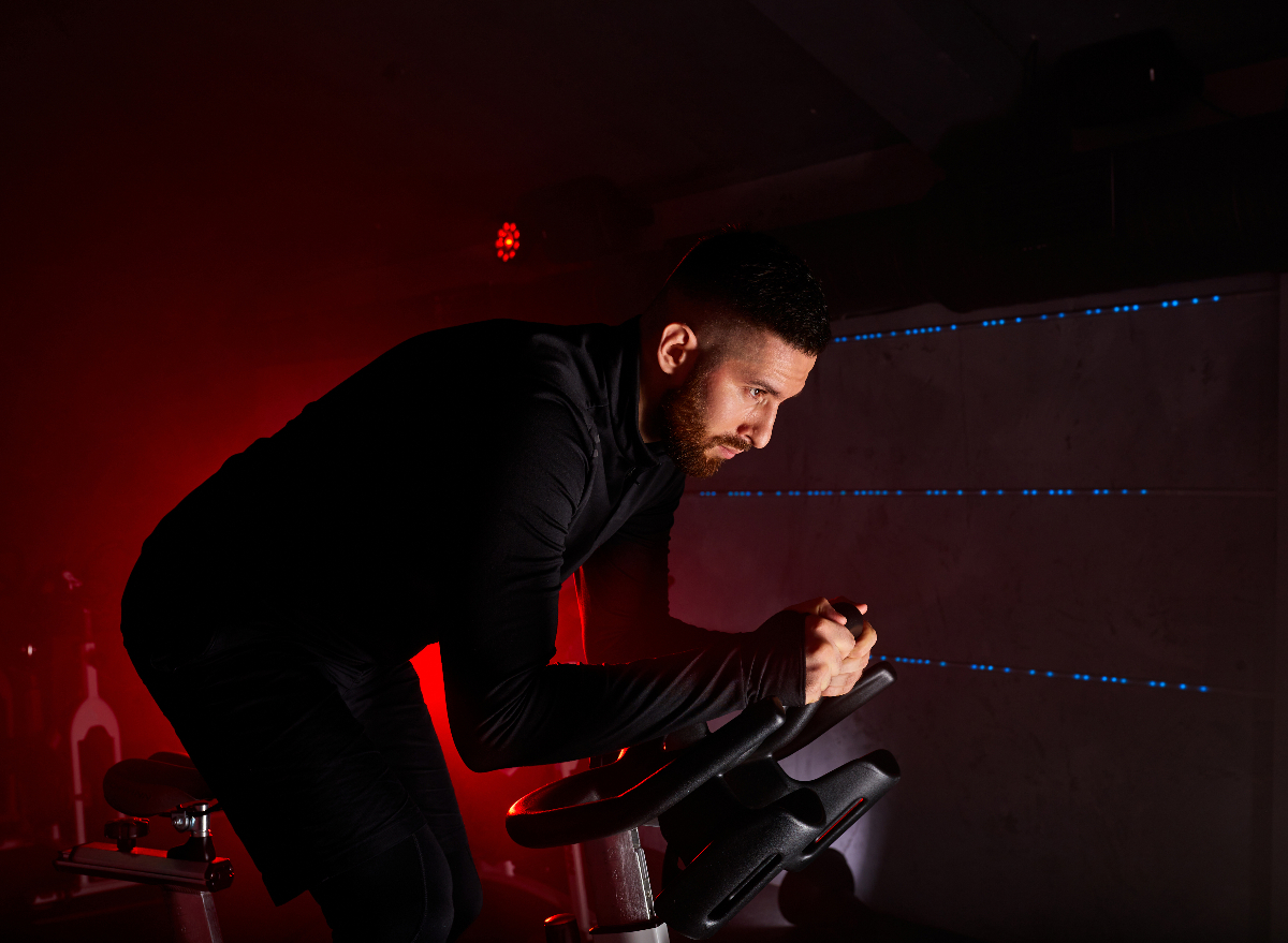 man intense indoor cycling