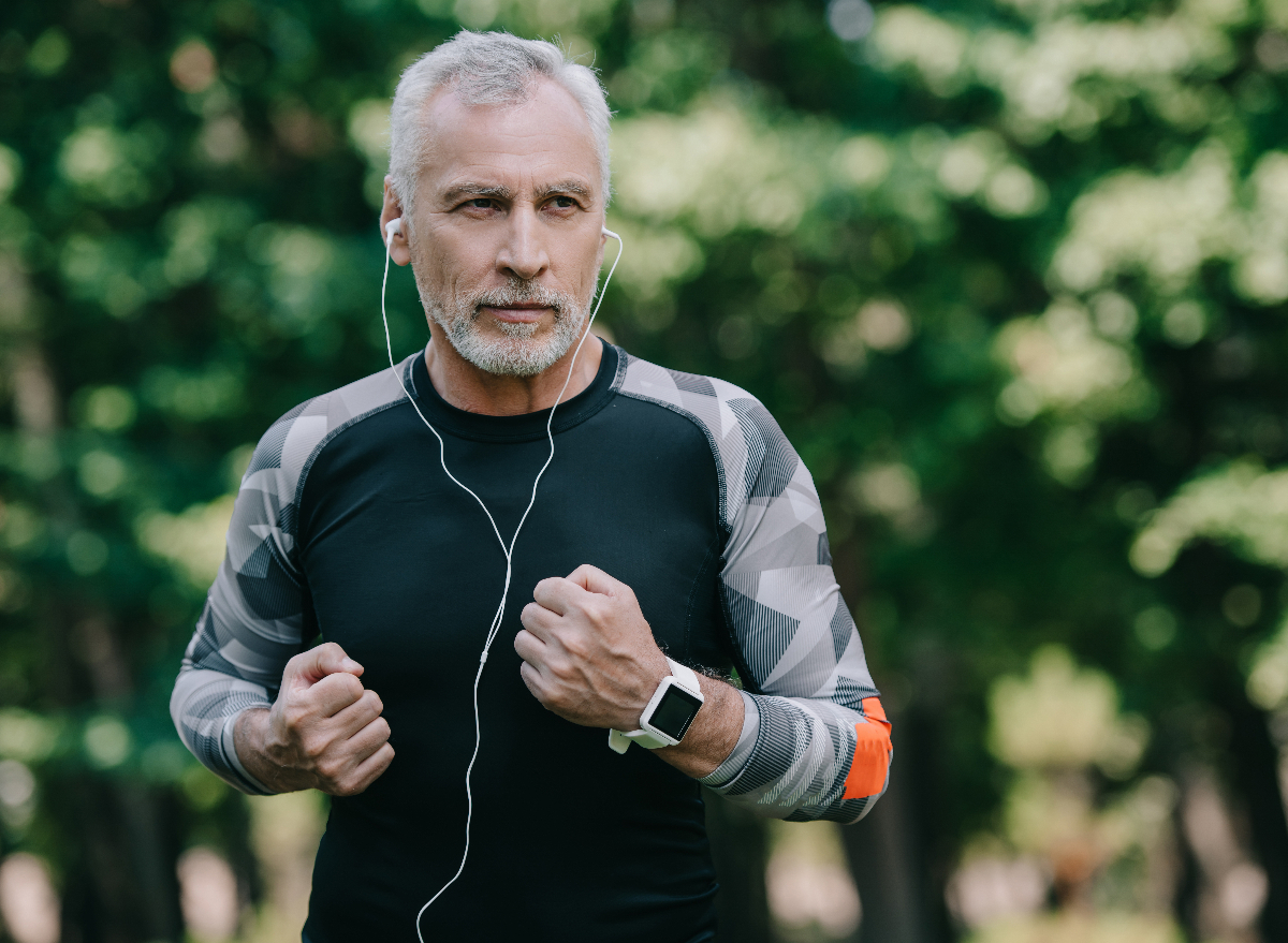 man running in central park to improve his gut health