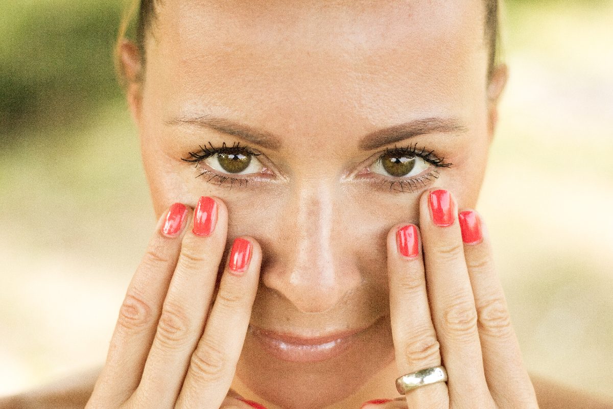 woman practicing face yoga