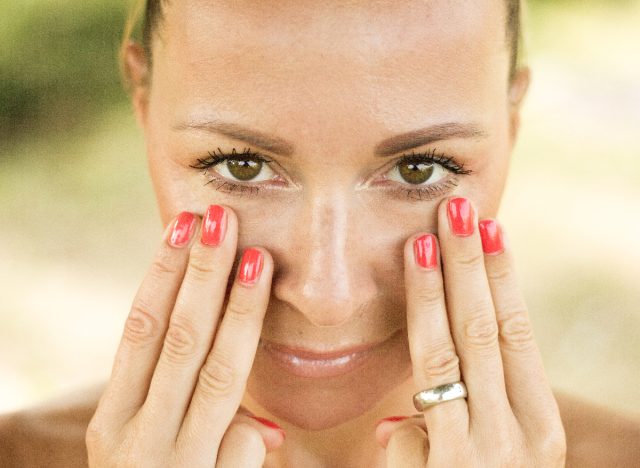 woman practicing face yoga