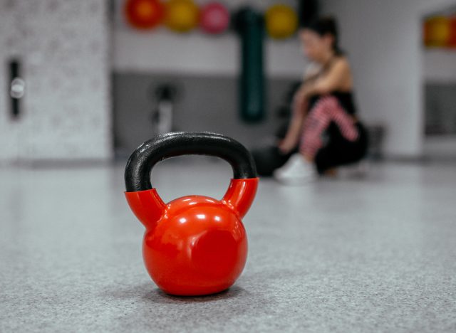 red kettlebell on gym floor
