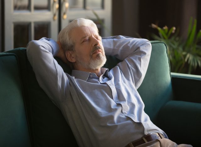 older person taking nap on the couch