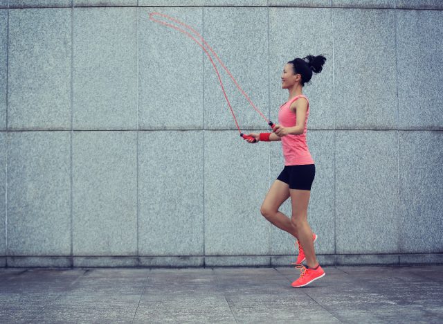 woman jumping rope outside