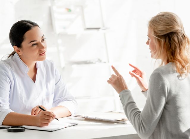 woman chats with dermatologist