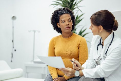 patient speaking with doctor