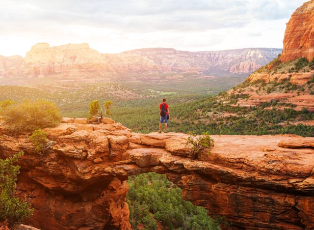 man hiking in sedona, arizona