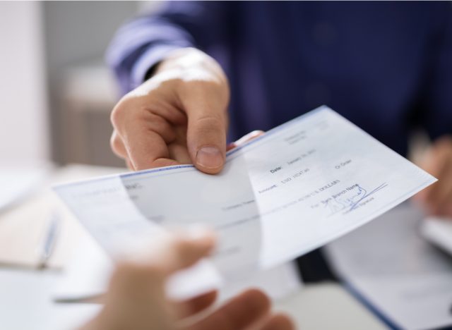 give a paycheck to an employee
