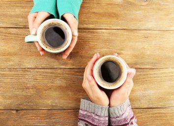 holding coffee cups