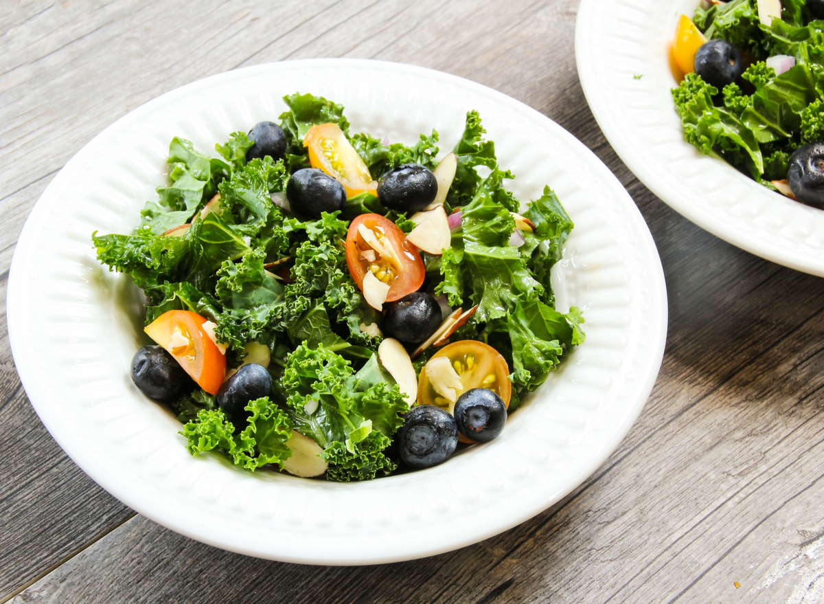 kale salad with blueberries and cherry tomatoes