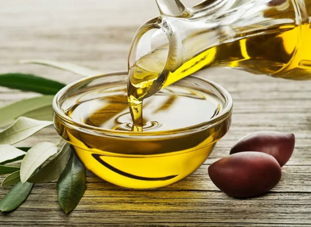 olive oil being poured into bowl, concept of tips to keep the weight off for good