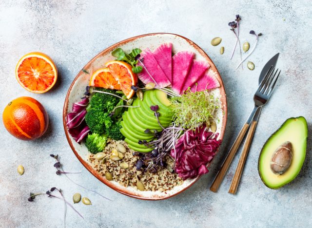 plant-based bowl with veggies, quinoa, seeds, and blood orange