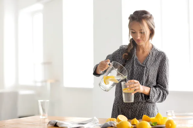 Pouring lemon water