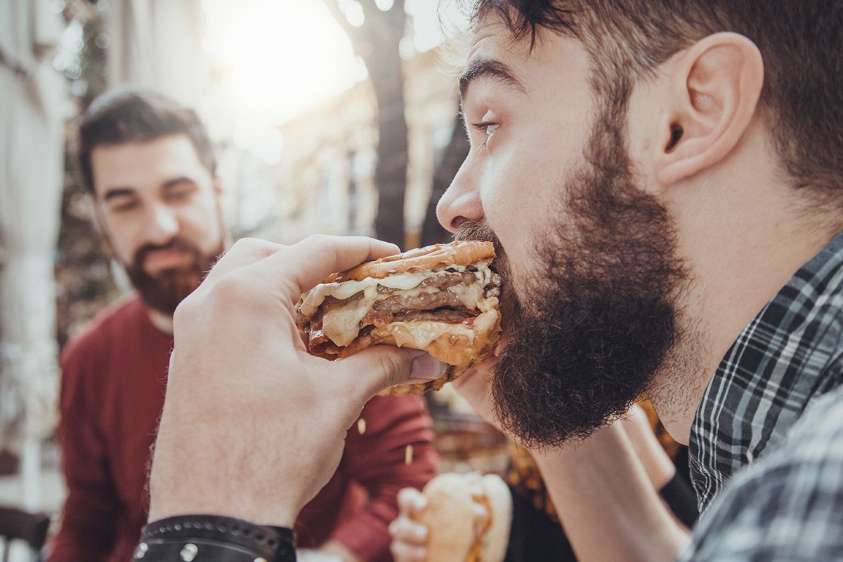 man eating a burger