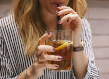 woman drinking iced tea