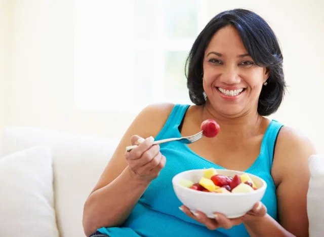 middle aged woman eating