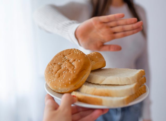 woman saying no to bread