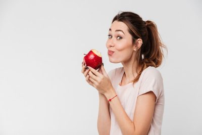 Woman Eating Red Apple