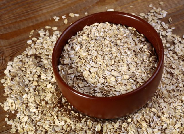 Oats in bowl and on the table