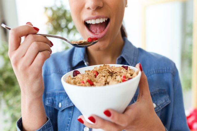 woman eating cereal