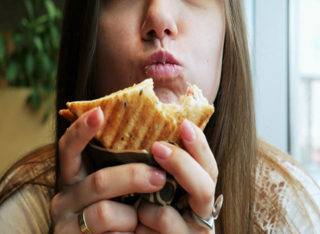 Woman Eating Sandwich