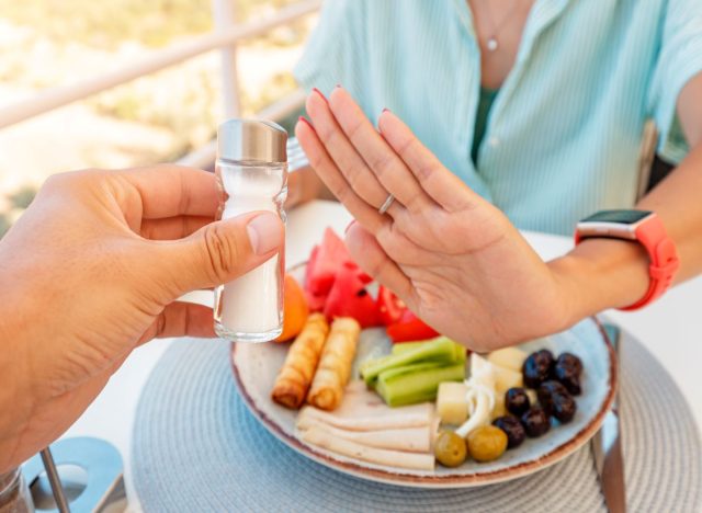 Woman Refusing Salt Shaker