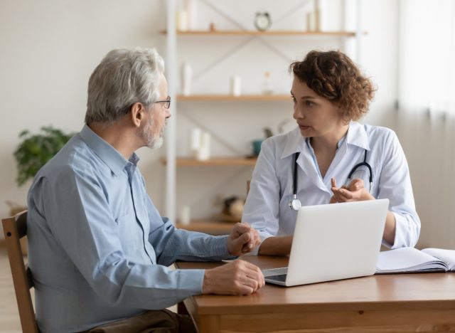 middle-aged man chatting with doctor