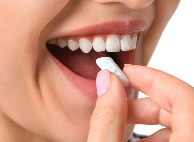 woman getting ready to chew gum, close-up