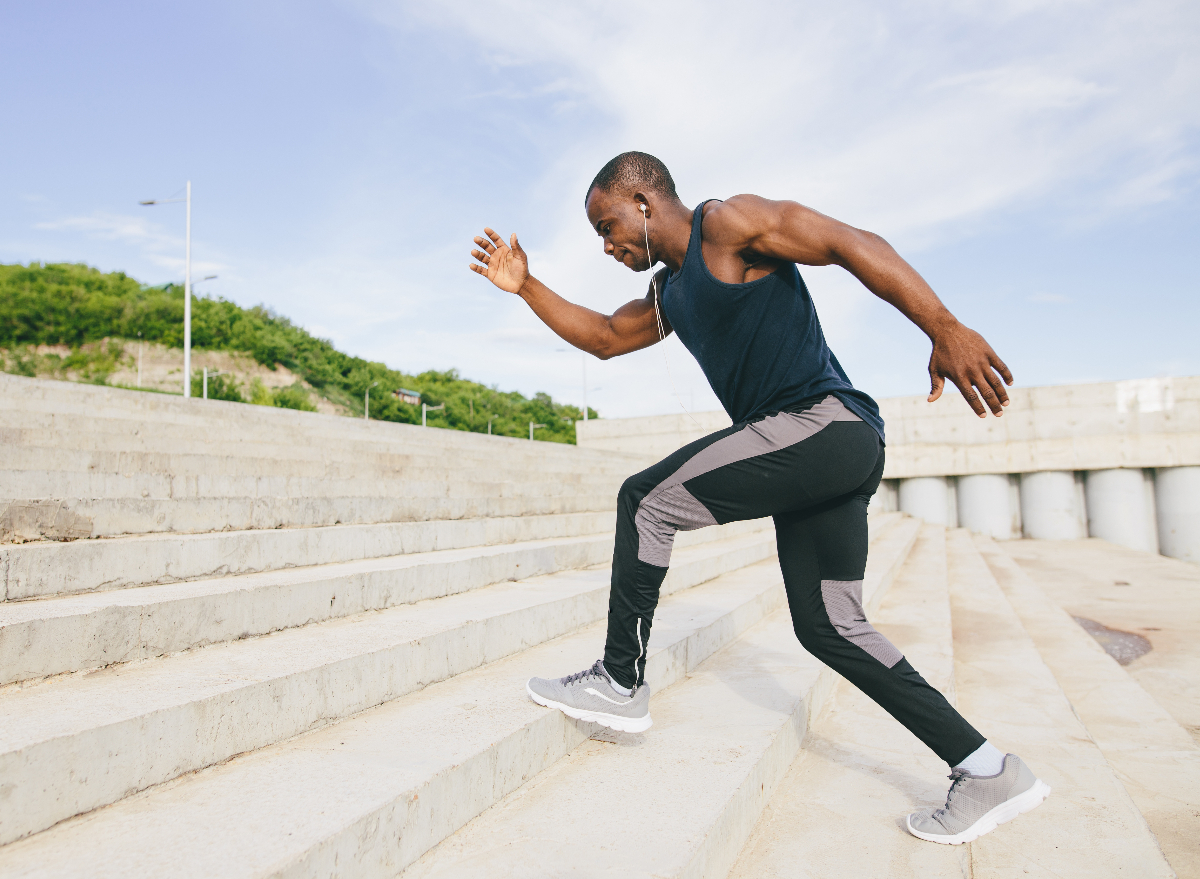 fit man running up steps to build calf muscles