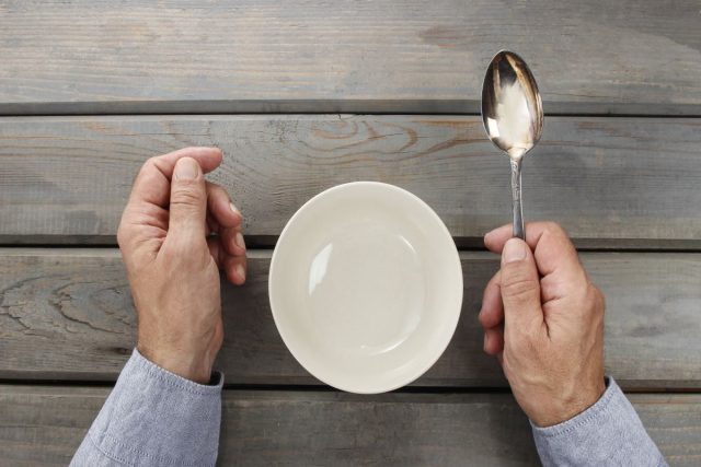 Hands holing spoon