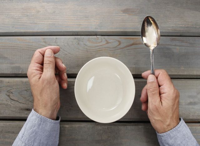 Hands holing spoon