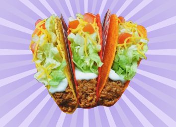 A trio of Taco Bell tacos against a colorful background