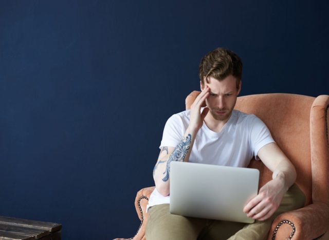 Man losing focus on laptop