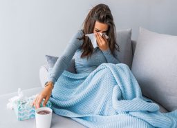 Sick woman on couch