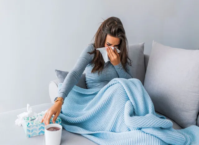 Sick woman on couch 