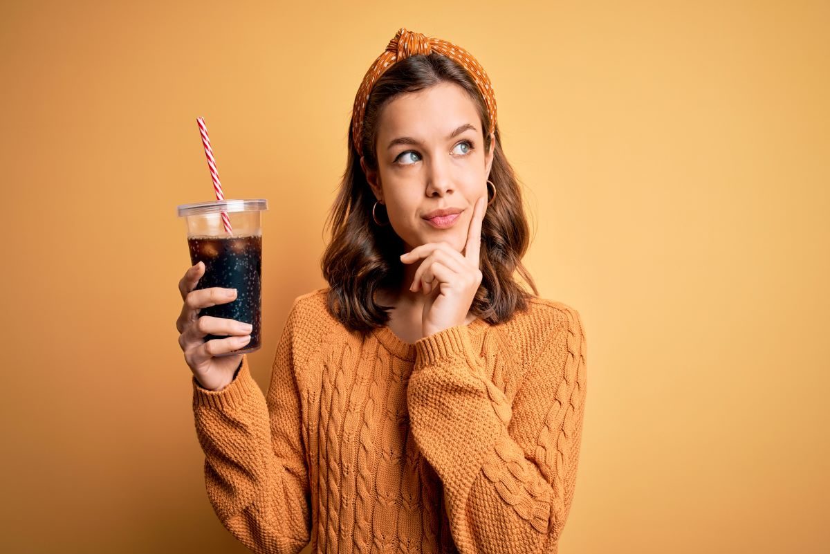 Woman Holding Soda