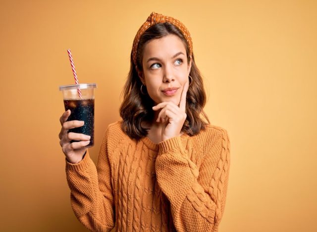 Woman Holding Soda