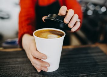 barista holding cappuccino