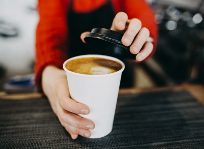 barista holding cappuccino