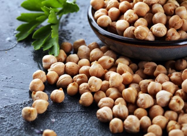 chickpeas in bowl and on table, healthy carbs for weight loss