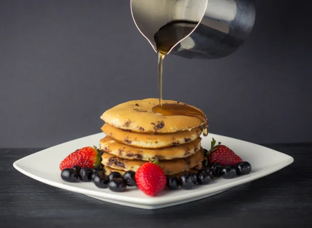 chocolate chip pancakes with berries and maple syrup